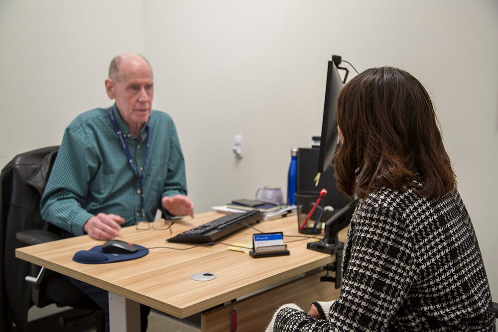 student talking with staff